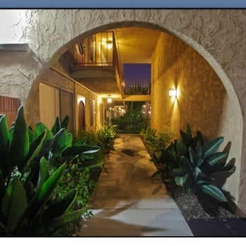 Rio De Janeiro Apartments - The back entrance from the parking lot - Apartments Near Me - Bellflower, California Rio De Janeiro Apartments - The back entrance from the parking lot - Apartments Near Me - Bellflower, California