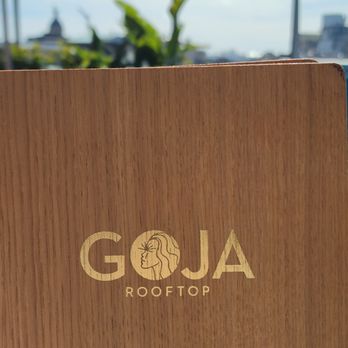 Goja Rooftop - Menu front city behind - Whiskey Bars Near Me - Barcelona, B Goja Rooftop - Menu front city behind - Whiskey Bars Near Me - Barcelona, B