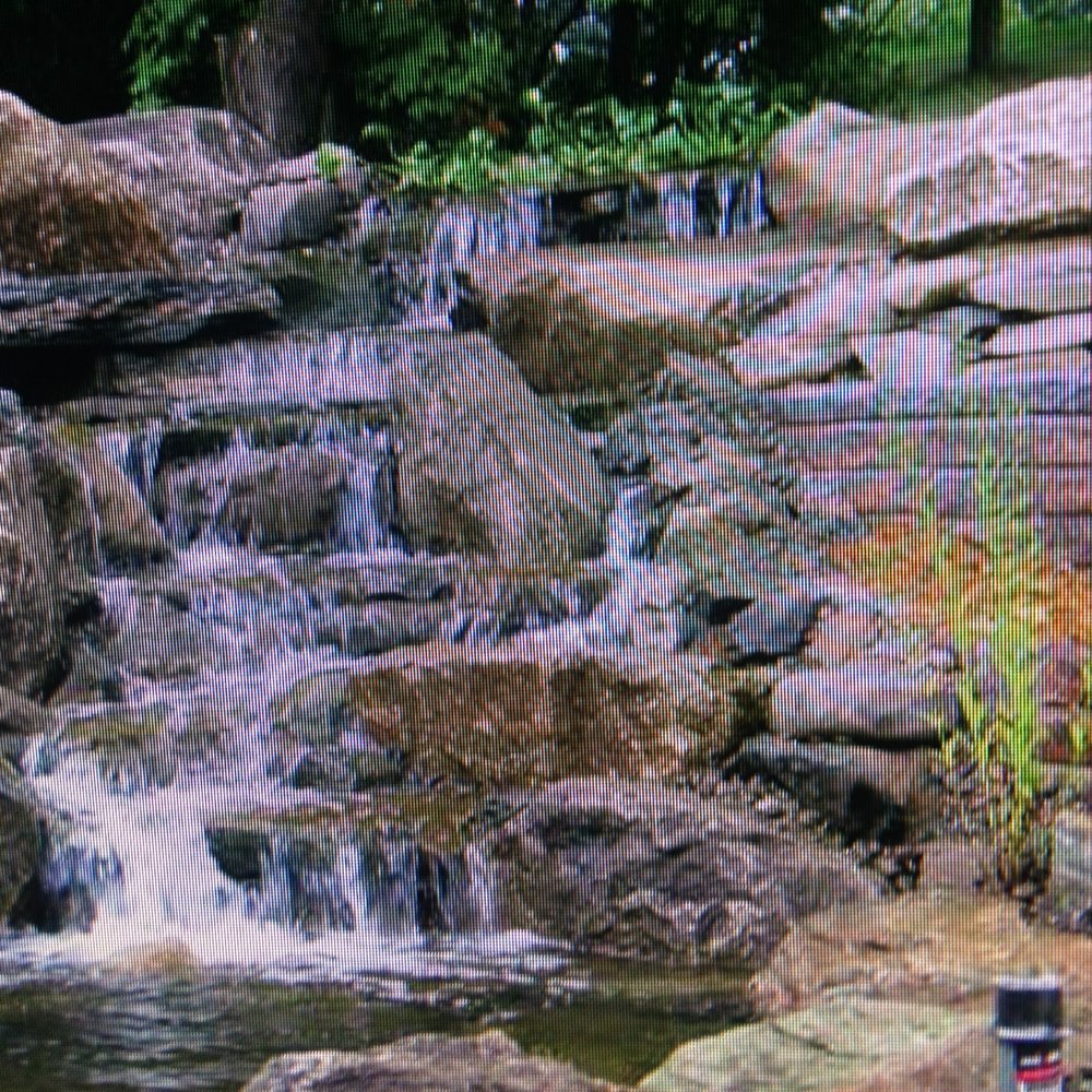 a waterfall in a park