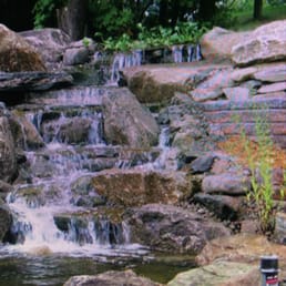 a waterfall in a park