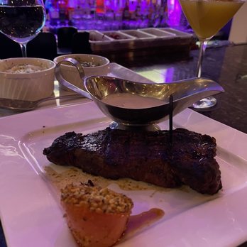 Blvck Cow - New York Strip with a garlic sauce - Cocktail Bars Near Me - Bowie, Maryland