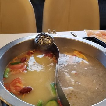 Liuyishou Hotpot - The two soup option, coconut water chicken soup base and pork rib soup base - Hot Pot Near Me - Flushing, New York