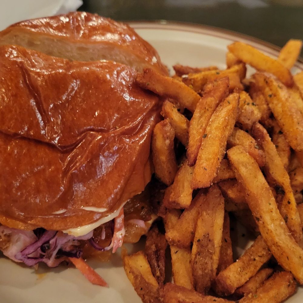 The Wren - a sandwich and french fries on a plate - Bars Near Me - Toronto, Ontario The Wren - a sandwich and french fries on a plate - Bars Near Me - Toronto, Ontario