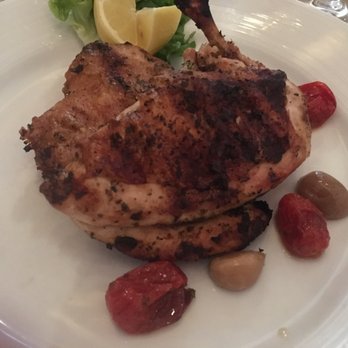 Axia Taverna - The half roasted free range chicken was moist and tasty. Liked the tomato and roasted garlic garnish. - Greek Near Me - Tenafly, New Jersey