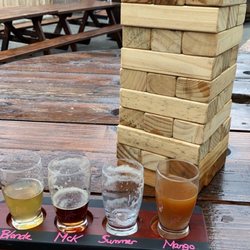 Willow Creek Brewing - Flight on the back deck with giant Jenga and cornhole!