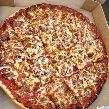 Brads Underground Pizzeria - Thin crust pizza with sausage and bacon + extra sauce - Pizza Near Me - Orlando, Florida Brads Underground Pizzeria - Thin crust pizza with sausage and bacon + extra sauce - Pizza Near Me - Orlando, Florida