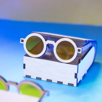 Lollipop Laser - Playful laser cut plywood box with living hinge, combined with stylish laser cut acrylic and wood sunglasses. - Product Design Near Me - Brooklyn, New York Lollipop Laser - Playful laser cut plywood box with living hinge, combined with stylish laser cut acrylic and wood sunglasses. - Product Design Near Me - Brooklyn, New York