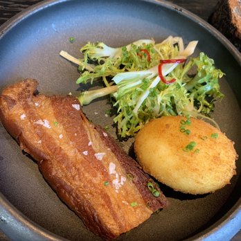 Stubborn Seed - Pork belly with frisée salad and egg - New American Near Me - Miami Beach, Florida Stubborn Seed - Pork belly with frisée salad and egg - New American Near Me - Miami Beach, Florida