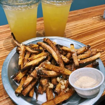 EARL Kakaako - Garlic fries and 2 Lilikoi lemonade - Sandwiches Near Me - Honolulu, Hawaii