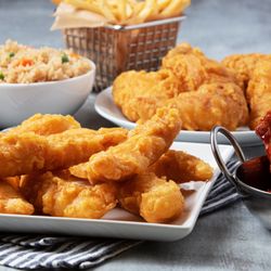Mr. Wong's Chicken & Rice - Tempura-battered chicken fingers and wings, seasoned Hawaiian wings, fried rice, French fries, and dipping sauce