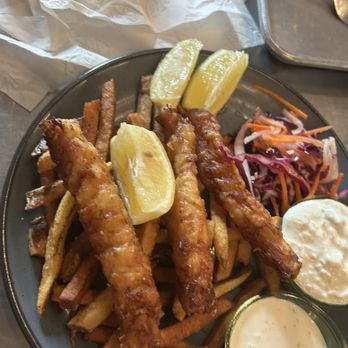 Base Camp Provisions - Fish and chips were more like fish stick size pieces. Look at the lemon wedge for size - Bars Near Me - Fruita, Colorado Base Camp Provisions - Fish and chips were more like fish stick size pieces. Look at the lemon wedge for size - Bars Near Me - Fruita, Colorado