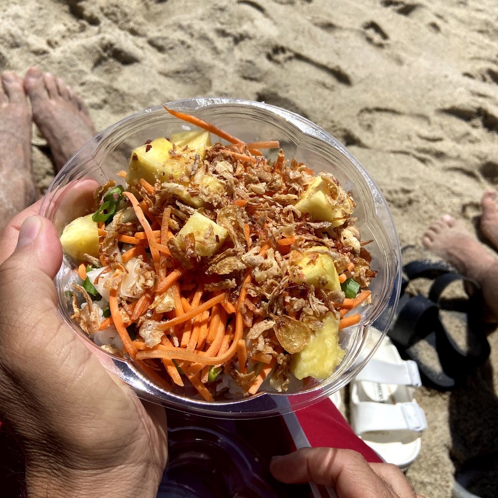 Nantucket Poke - a person holding a bowl of food - Poke Near Me