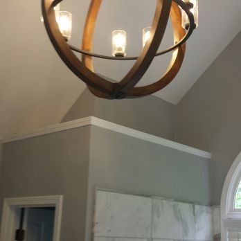 AGV Constructions - a chandelier made of wood and glass - General Contractors Near Me