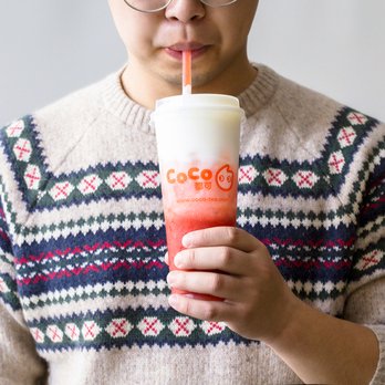 CoCo Fresh Tea & Juice - a man holding a drink - Bubble Tea Near Me - Toronto, Ontario CoCo Fresh Tea & Juice - a man holding a drink - Bubble Tea Near Me - Toronto, Ontario