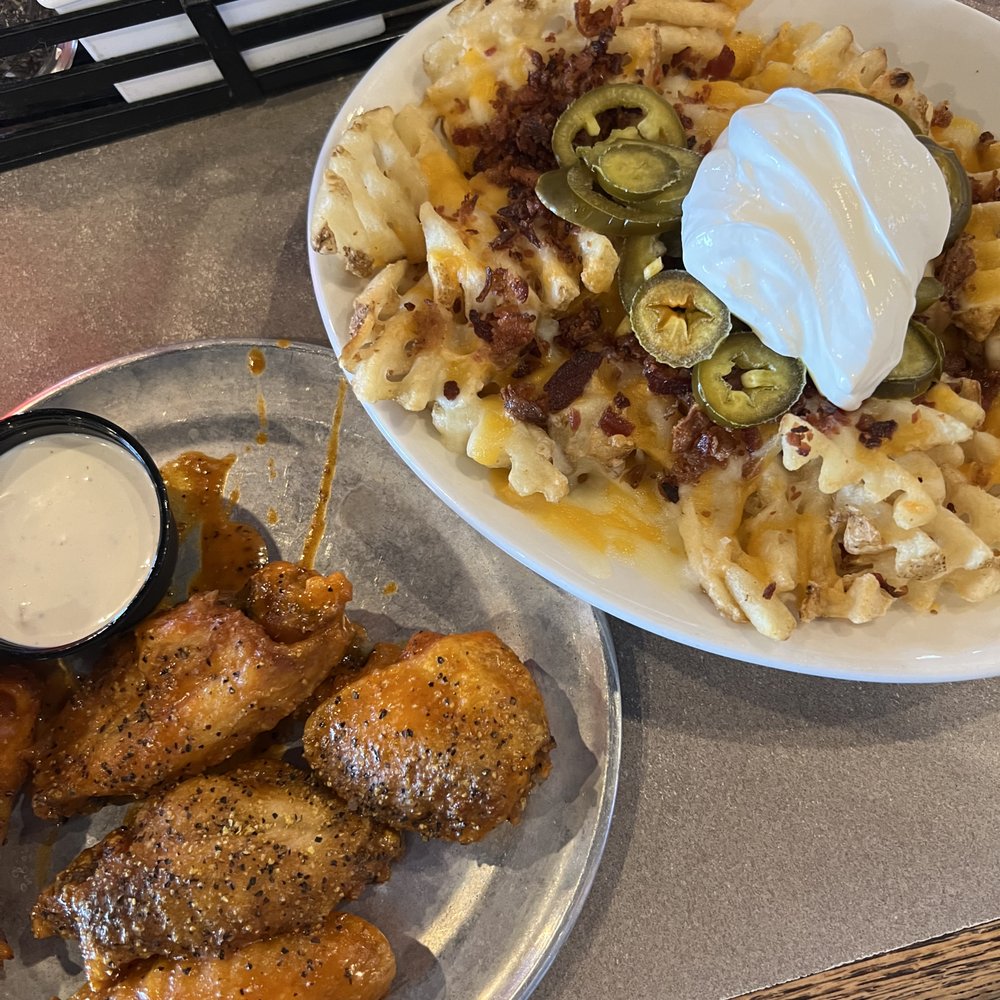 Pluckers Wing Bar - South Lamar - Spicy Lemmon pepper wings with blue cheese. Blue Cheese was good but I still prefer the ranch. Cheese loaded fries were delicious! - Chicken Wings Near Me - Austin, Texas Pluckers Wing Bar - South Lamar - Spicy Lemmon pepper wings with blue cheese. Blue Cheese was good but I still prefer the ranch. Cheese loaded fries were delicious! - Chicken Wings Near Me - Austin, Texas