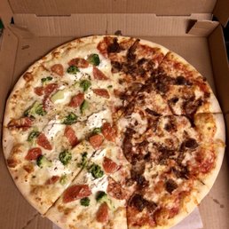 Large pizza - half white with fresh garlic, ricotta, tomato, & broccoli and the other half regular with sausage. AMAZING!!
