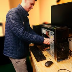 Everyone loves Caleb and he really loves getting into the guts of the computers.
