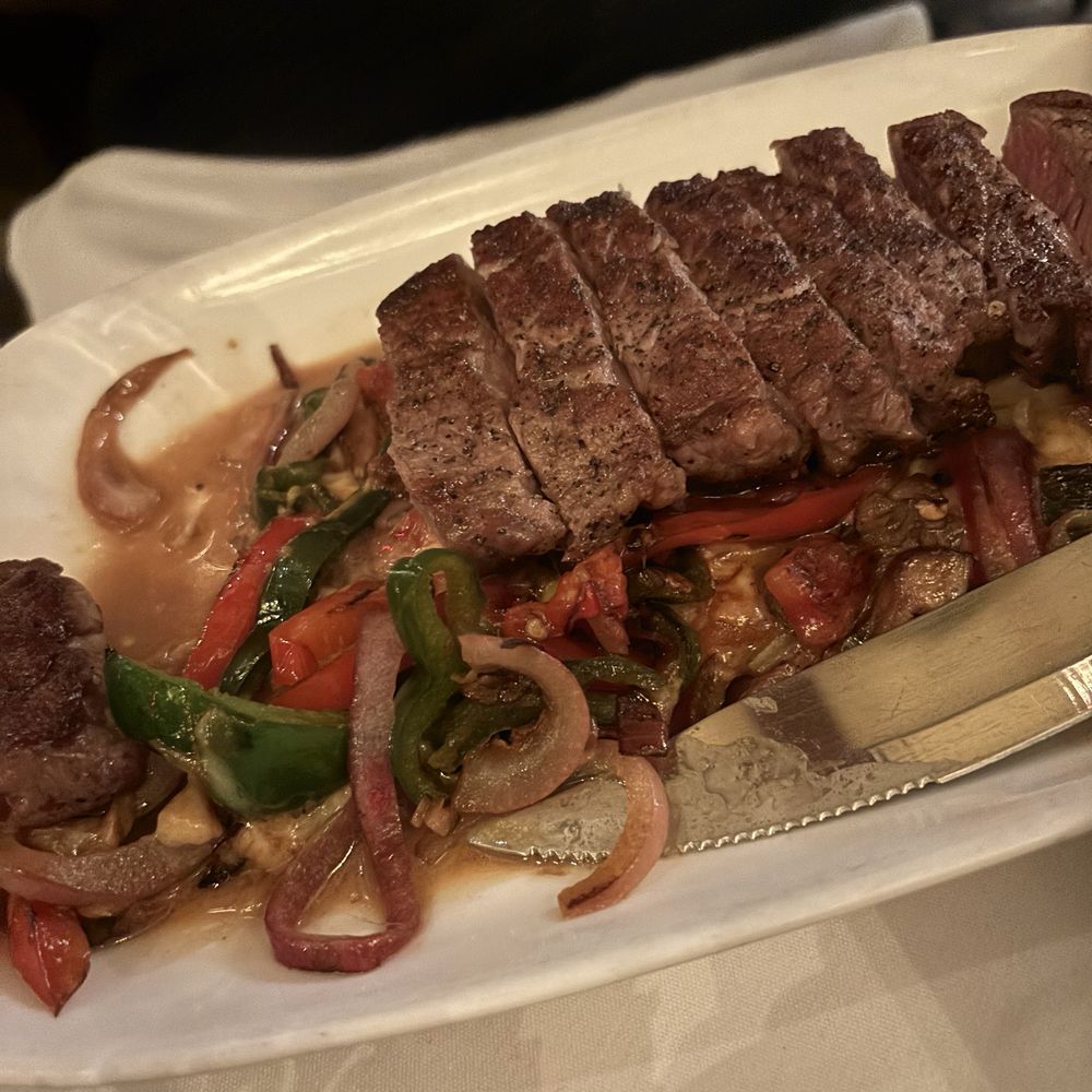 Fajitas, was expecting it to come out on sizzle pan, but my hubby liked it just fine. HUGE portion though. Fajitas, was expecting it to come out on sizzle pan, but my hubby liked it just fine. HUGE portion though.