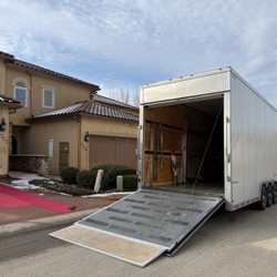 First Class Relocation and Storage - Winter move in full effect. Runners placed to protect the home and keep everything clean despite the snow outside.