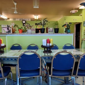 Wasana Restaurant - a dining table and chairs - Thai Near Me - Brooks, Alberta Wasana Restaurant - a dining table and chairs - Thai Near Me - Brooks, Alberta