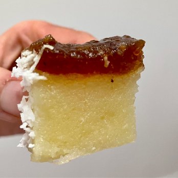 Kuih Cafe - Ubi Kayu-Sago: steamed sago with gula Melaka (palm sugar) layered over cassava, sprinkled with grated coconut - Desserts Near Me - New York, New York Kuih Cafe - Ubi Kayu-Sago: steamed sago with gula Melaka (palm sugar) layered over cassava, sprinkled with grated coconut - Desserts Near Me - New York, New York