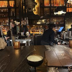 The bar seating with pistachio martini