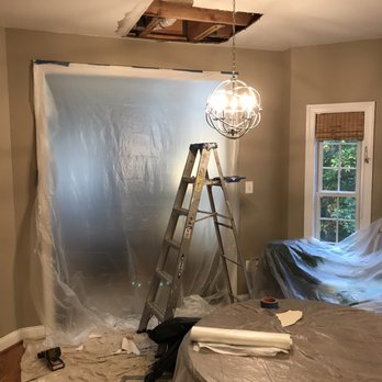 Snell Home Services - DAMAGE CAUSED BY SNELL: Hole in kitchen ceiling after drywall and more water was removed after damage from Snell Heating & Air visit - Heating & Air Conditioning/HVAC Near Me - Sterling, Virginia