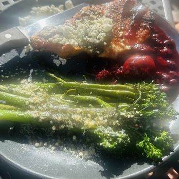 Outback Crab Shack - Smoked bone in pork chop with berry compote, goat cheese, chimichurri with broccolini - Seafood Near Me - Saint Augustine, Florida