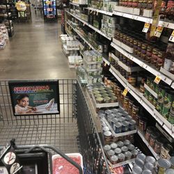 Fred Meyer - Can't even walk down the isles with another shopper.