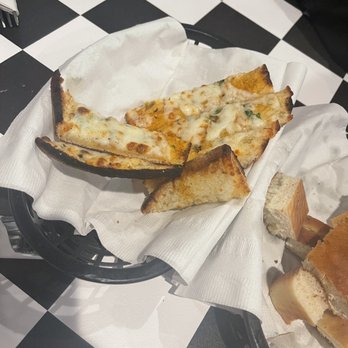 Piccolino - Cheesy garlic bread. Sorry we couldn't wait to take the picture. - Italian Near Me - Santa Fe, New Mexico Piccolino - Cheesy garlic bread. Sorry we couldn't wait to take the picture. - Italian Near Me - Santa Fe, New Mexico