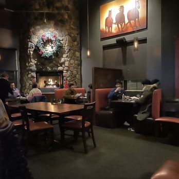 Tavern West - people sitting around a table - New American Near Me - Frisco, Colorado Tavern West - people sitting around a table - New American Near Me - Frisco, Colorado