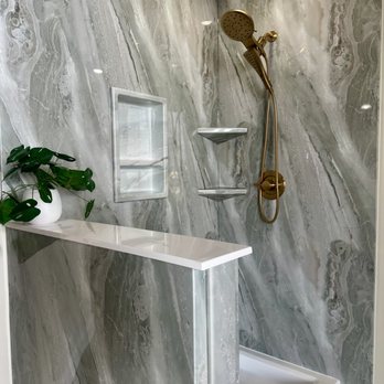Re-Bath - Our DuraBathâ„¢ Monterey wall surround enhances this space with ample shelving and brushed gold fixtures. - General Contractors Near Me - Tulsa, Oklahoma Re-Bath - Our DuraBathâ„¢ Monterey wall surround enhances this space with ample shelving and brushed gold fixtures. - General Contractors Near Me - Tulsa, Oklahoma