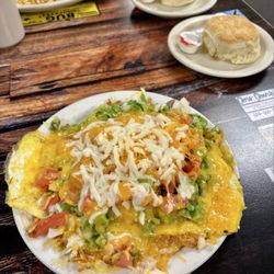 Bleus Family Dining - Garden scramble. It was a lot of food! The hashbrowns are under the eggs. Get the biscuit, trust me!!