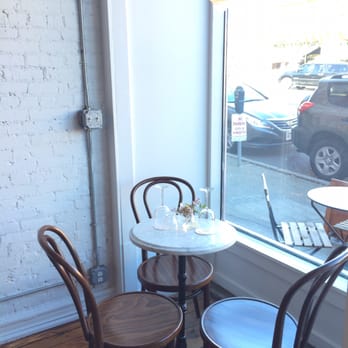 Brunette - Cute tables in front of window - Wine Bars Near Me - Kingston, New York Brunette - Cute tables in front of window - Wine Bars Near Me - Kingston, New York
