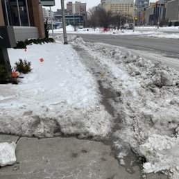 Side walk on hotel property not shoveled one week after snow storm and ramp into property not cleared up to curbing properly. Side walk on hotel property not shoveled one week after snow storm and ramp into property not cleared up to curbing properly.
