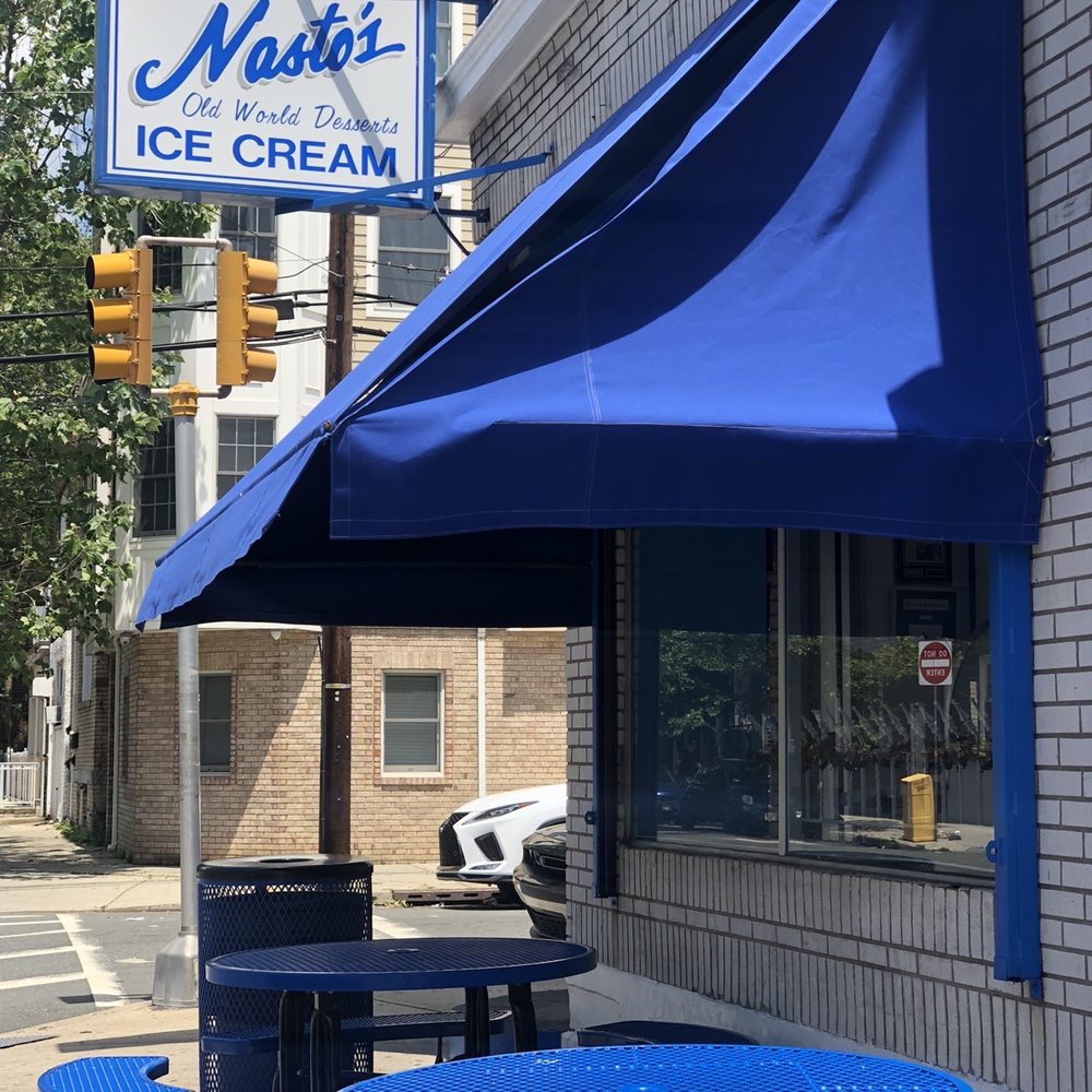Nasto's Ice Cream - blue tables and umbrella - Ice Cream & Frozen Yogurt Near Me - Newark, New Jersey Nasto's Ice Cream - blue tables and umbrella - Ice Cream & Frozen Yogurt Near Me - Newark, New Jersey