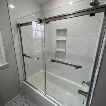 Konrad’s Fine Renovation - a bathroom with a glass shower - Kitchen & Bath Near Me