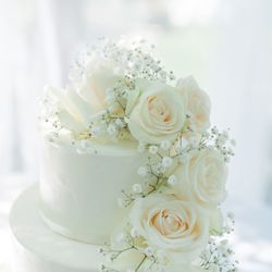 Ingrid Fraser - Cakes - 3 tier wedding cake with different flavors for each tier and cascading white flowers
