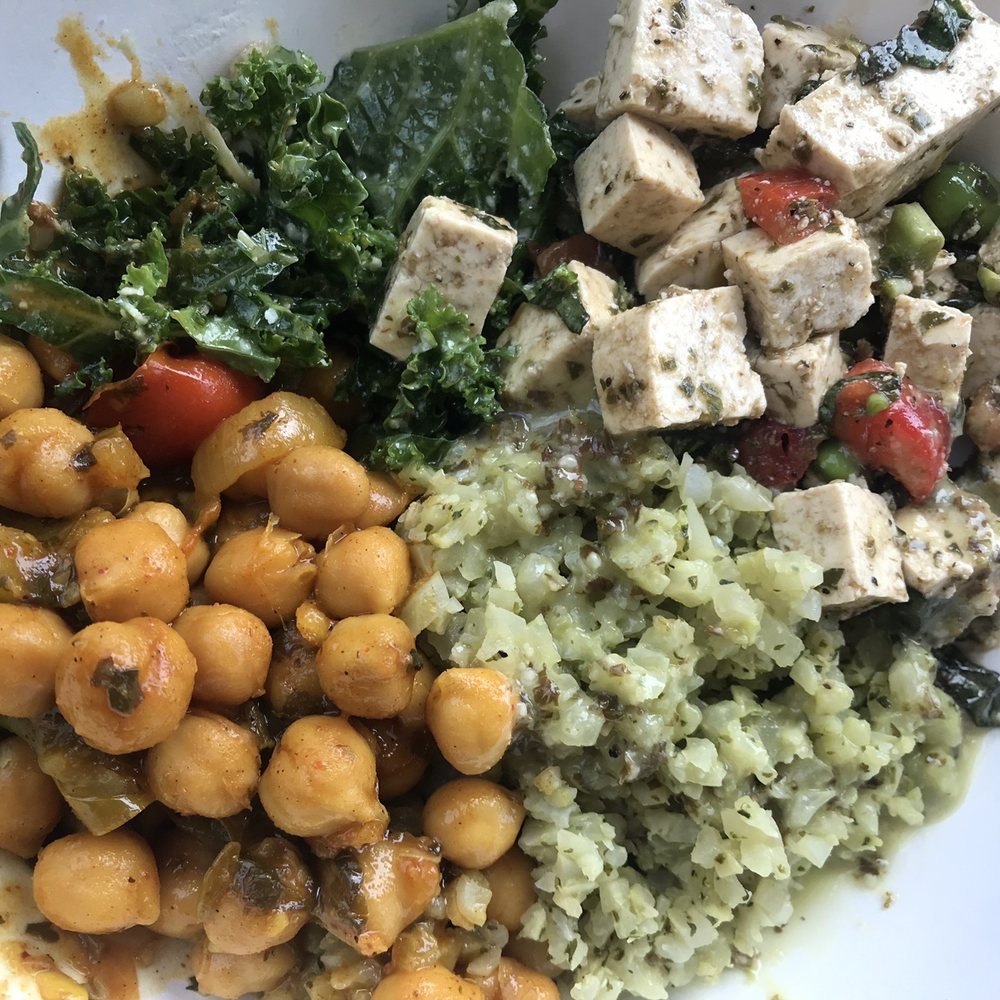 Four Bowl with Caprese Tofu over Kale Caesar, Avocado Cauli Rice, and Chickpea Rosa. I also got Holy Kale dressing. Total yum. Four Bowl with Caprese Tofu over Kale Caesar, Avocado Cauli Rice, and Chickpea Rosa. I also got Holy Kale dressing. Total yum.