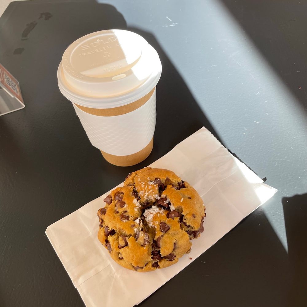 a donut and a cup of coffee