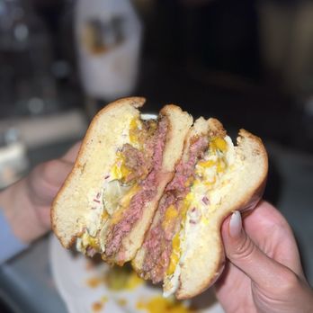 Au Cheval - Double Cheeseburger (~$25) with Farm Egg (~$4) - cross-section view - Burgers Near Me - New York, New York Au Cheval - Double Cheeseburger (~$25) with Farm Egg (~$4) - cross-section view - Burgers Near Me - New York, New York