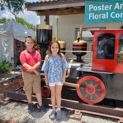 The Greater Lake Placid Chamber of Commerce - The Lewis twins of Vero Beach - William and Rebecca - enjoying the Caladium Festival in Lake Placid, Florida.