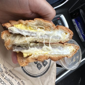 Donut Delight - a person holding a sandwich - Donuts Near Me - Stamford, Connecticut Donut Delight - a person holding a sandwich - Donuts Near Me - Stamford, Connecticut