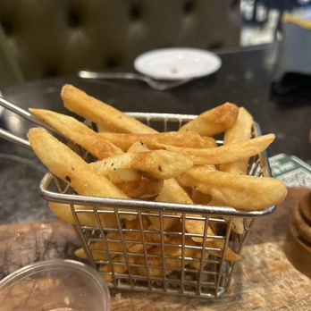 Uptown Brasserie - Pre cooked and sitting around fries. - Brasseries Near Me - Jamaica, New York