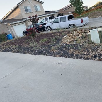 Top Notch Landscape Management - a white truck parked in front of a house - Landscaping Near Me Top Notch Landscape Management - a white truck parked in front of a house - Landscaping Near Me