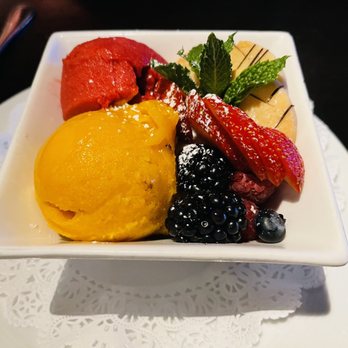 The Mercury - Trio sorbet with mango, raspberry, coconut. So good! - Steakhouses Near Me - Dallas, Texas
