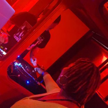 Legendary Vegas - a woman playing a video game - Club Crawl Near Me