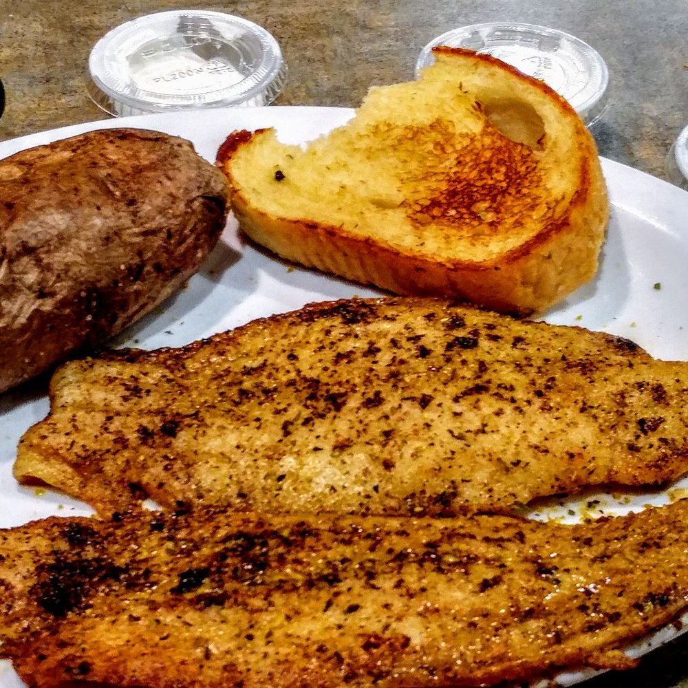 Country Pride - fish dinner  didn't want the all-you-can-eat for a buck-fifty more but two pieces were plenty grilled lemon pepper. baked potato and bread - Breakfast & Brunch Near Me - Seymour, Indiana