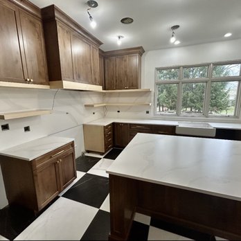 TTS Granite - a kitchen with a black and white checkered floor - General Contractors Near Me - Steger, Illinois TTS Granite - a kitchen with a black and white checkered floor - General Contractors Near Me - Steger, Illinois