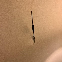 Hotel Mint JFK Airport - Hole in the wall with God only knows what sticking out. Close inspection we determined it didn't seem to be a camera.